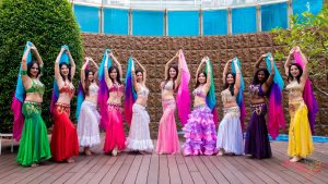 belly dancers both hands up pose